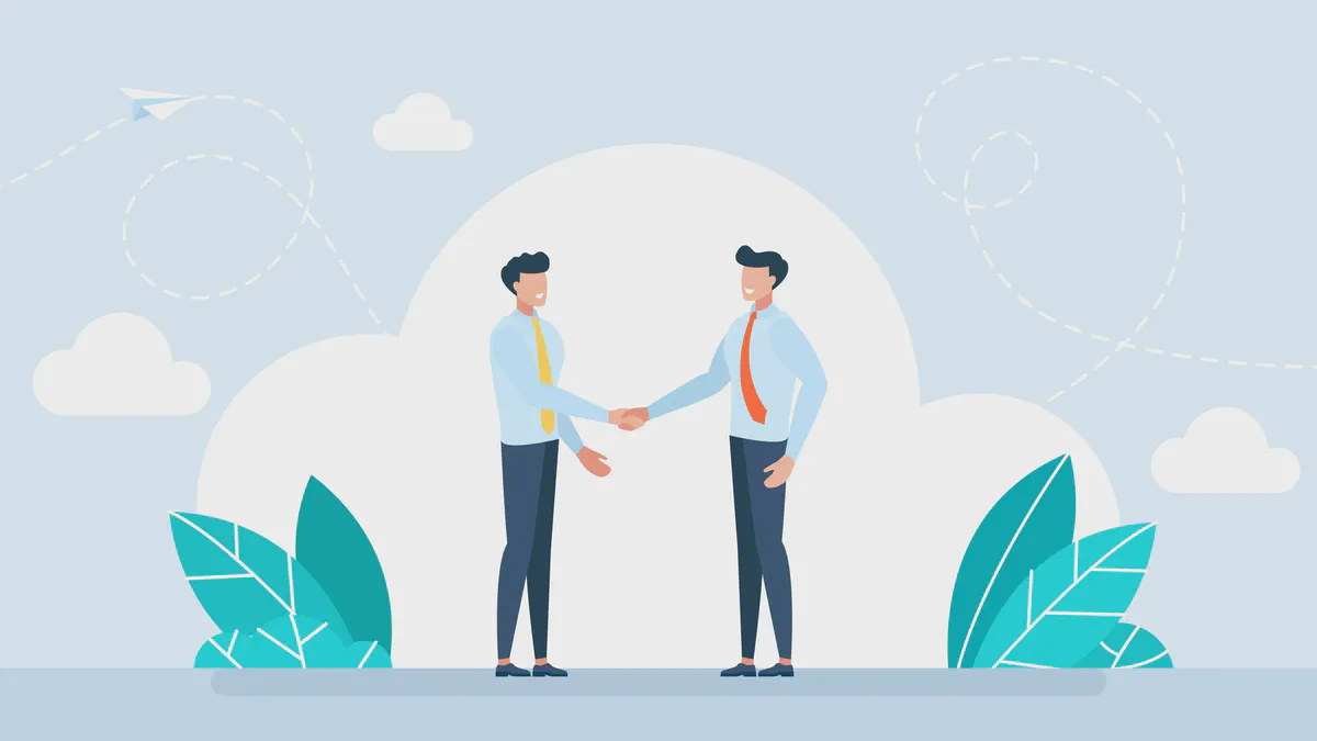 Two men with ties shaking hands