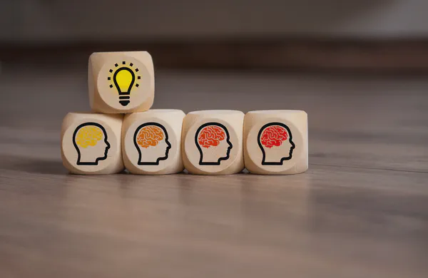 Wooden blocks depicting a creative team